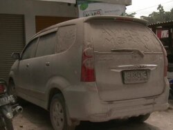 Writing scrawled in ash coated over car, Indonesia 28 October 2010 / AUDIO Stock Footage