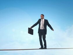 Business man doing balancing act Stock Footage