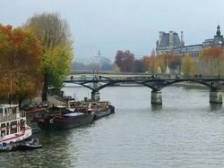 Seine and Cityscape with Pont des Arts and Palais du Louvre, Paris, France Stock Footage