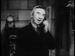 B/W 1940 mad scientist (Bela Lugosi) talking on telephone in laboratory Stock Footage