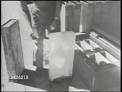 1944: BATTLE OF ENIWETOK:  VS U.S. 'Ice Plant' on Enjebi island, U.S. soldier unpacking large sheet of ice, putting ice into cold storage freezer. World War II, WWII, Pacific Front, aka Enewetak, Marshall Islands Campaign Instructional Video