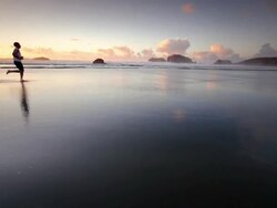 WS SLO MO POV TS View of teen boy running on beach / Bandon, Oregon, United States Stock Footage