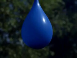 High speed Blue balloon bursts 1000fps Stock Footage