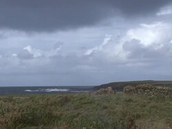 WS Storm clouds rolling in over the coast of the Orkney Islands / Orkney, Scotland, United Kingdom Stock Footage