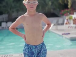 MS Boy running and jumping in pool / emerald isle, north carolina, United States Stock Footage