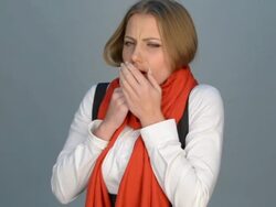 woman coughing and looking at camera Stock Footage