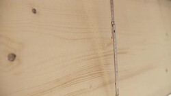 measuring a 2 x 4 with a tape measure Stock Footage