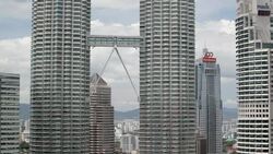 A walkway connects the Petronas Twin Towers. Stock Footage