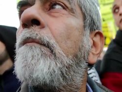 January 23, 2009 Men listening to speaker during protest against Israel's attack on Gaza Strip/ Men turning and looking/ Bearded man walking away/ Washington DC/ AUDIO Stock Footage