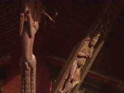 MS ZO Details of carvings in beams holding up  overhanging roof of Buddhist temple  / Kathmandu, Central, Nepal Stock Footage