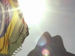 Brazilian flag on the wind, by Ipanema Beach Stock Footage