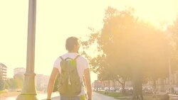 Man with longboard walking Stock Footage