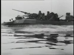 British amphibious tanks move into the water; British Prime Minister Winston Churchill arrives on land. News Clip
