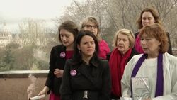 Activists in favour of women priests light pink flares close to Vatican News Clip