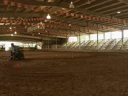 Long shot of child circling around a course in an ATV. Stock Footage