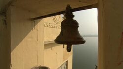 The wind blows a bell at Tulsi Ghat in India. Stock Footage