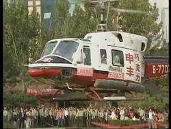 CHINA: SHANGHAI: 300 COUPLES TIE THE KNOT AT MASS WEDDING News Clip