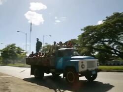 MS TS Shot of Truck with large group of people / Cuba Stock Footage