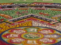 MS PAN  View of Circles and ornate patterns of sand  mandala and  monk finishing  e word 'ONE,' in  corner of  wooden platform  / Kathmandu, Central, Nepal Stock Footage
