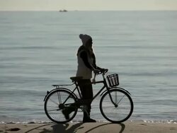 Friends taking bicycles by the sea Stock Footage