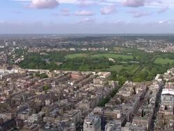 Aerial wide shot pan cityscape and Regents Park / London, England Stock Footage
