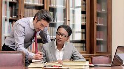 Lawyers working together in office Stock Footage