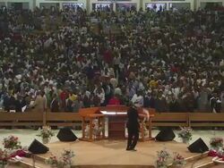 WS View of large church interior filling up with people praying, singing and dancing / Lagos, Nigeria Stock Footage