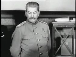 Russian dictator Joseph Stalin stands among Soviet military. News Clip