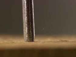 Extreme close up nail being hammered into wood Stock Footage