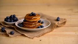 Stack of pancakes with fresh blueberry Stock Footage