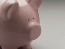 CU, ZO, MS, Studio shot of pink piggy bank with one dollar bill Stock Footage