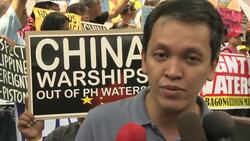 Protest over disputed territory in South China Sea; symposium seeks to cool SE Asia tensions News Clip