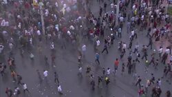 Police crack down on Taksim Square rally, protesters reply with flowers News Clip