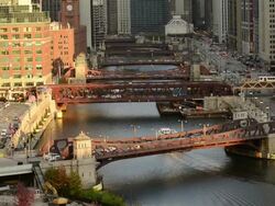 WS HA View of river and wacker drive showing passing train, boat and motor vehicle traffic / Chicago, Illinois, United States Stock Footage