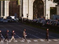 WS TU Shot of People crossing street to puerta de alcalÃƒÂ¡ / Madrid, Spain Stock Footage