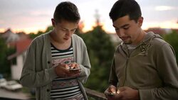 Young adults with phone Stock Footage