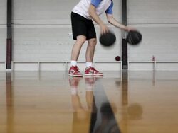 MS  young man practicing his dribbling of basketball inside  gymnasium / Minneapolis, Minnesota, United States  Stock Footage