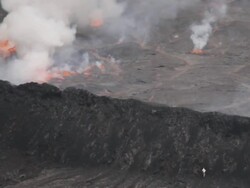 WS Volcanologist climbs toward lava lake in Nyiragongo crater / Virunga National Park, Goma, Democratic Republic of the Congo Stock Footage