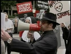Horror writers take their strike to Warner Brothers studios - where protestors held a producers' exorcism. News Clip