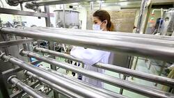 Scientist using digital tablet in pharmaceutical factory. Stock Footage