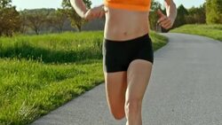 SLO MO TS Body of female marathon runner in motion Stock Footage
