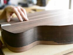Craftsman 'Luthier' Nigel Forster making hand made Guitars Stock Footage