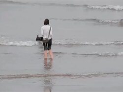 GIRL AND DOG IN SEA Stock Footage