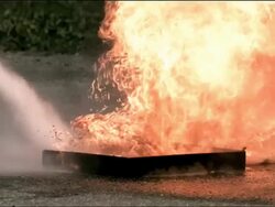 High speed Fire Extinguisher Powder, putting out fire Stock Footage