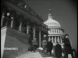 1939: U.S. CAPITOL: (POV doorway) MS Silhouette of people, Capitol BG. VS Capitol steps, US flag on Capitol entrance. INT HA WS President Franklin D. Roosevelt (1882-1945) addressing house (no SOT). WS Senate members in audience (dark). Washington DC Instructional Video