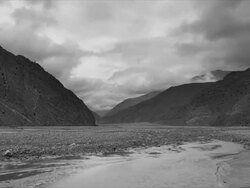 T/L with camera move, clouds, Jomsom Valley, Himalayas Stock Footage