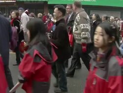 MS Shot of Crowd walking on street in Chinese new years parade AUDIO / Vancouver, British Columbia, Canada Stock Footage