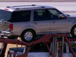 Aerial LA ECU car transporter on Highway / Mojave Desert, California, United States. Stock Footage