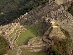 Scenic shots of Machu Picchu structures and garden terraces. Shots of llamas at Machu Picchu. Stock Footage