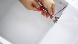 Hands repairing white wooden furnitures Stock Footage